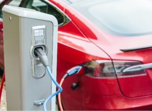 Vehicle with an electric motor. Electric vehicle charging. Eco car.